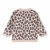 Leopard print sweater on a white background