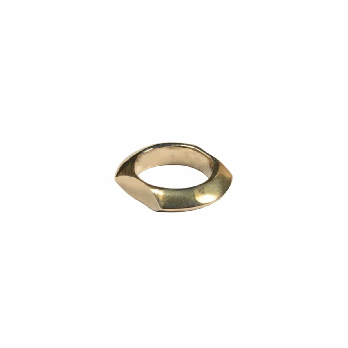 Gold ring with a geometric design on a light gray background