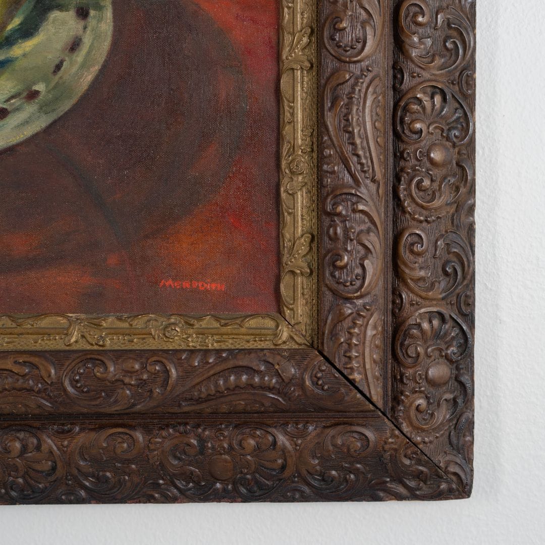 Close-up of an ornate wooden frame with intricate carvings on a white background