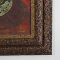 Close-up of an ornate wooden frame with intricate carvings on a white background