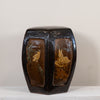 A vintage octagonal ceramic stool or box with a glossy black and brown glaze, featuring hand-painted floral and bird motifs on the front panels, set against a plain light background.