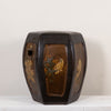 A dark brown glazed octagonal ceramic stool with hand-painted floral and bird motifs on the front panels, set against a plain off-white background.
