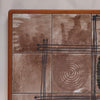 Close up of the geometrically designed tiles of a 1970's Vintage Ox Art Coffee Table