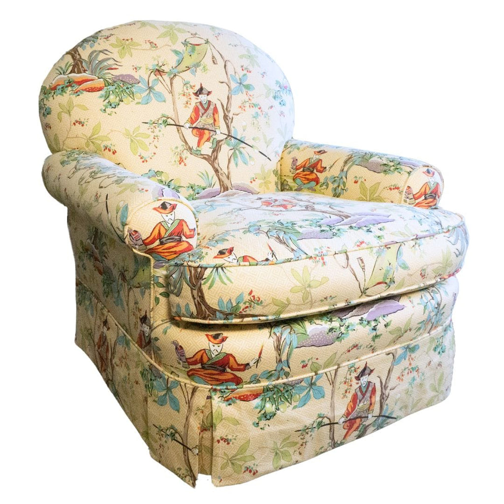 Upholstered armchair with Asian-inspired print.