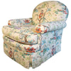 Upholstered armchair with Asian-themed fabric.