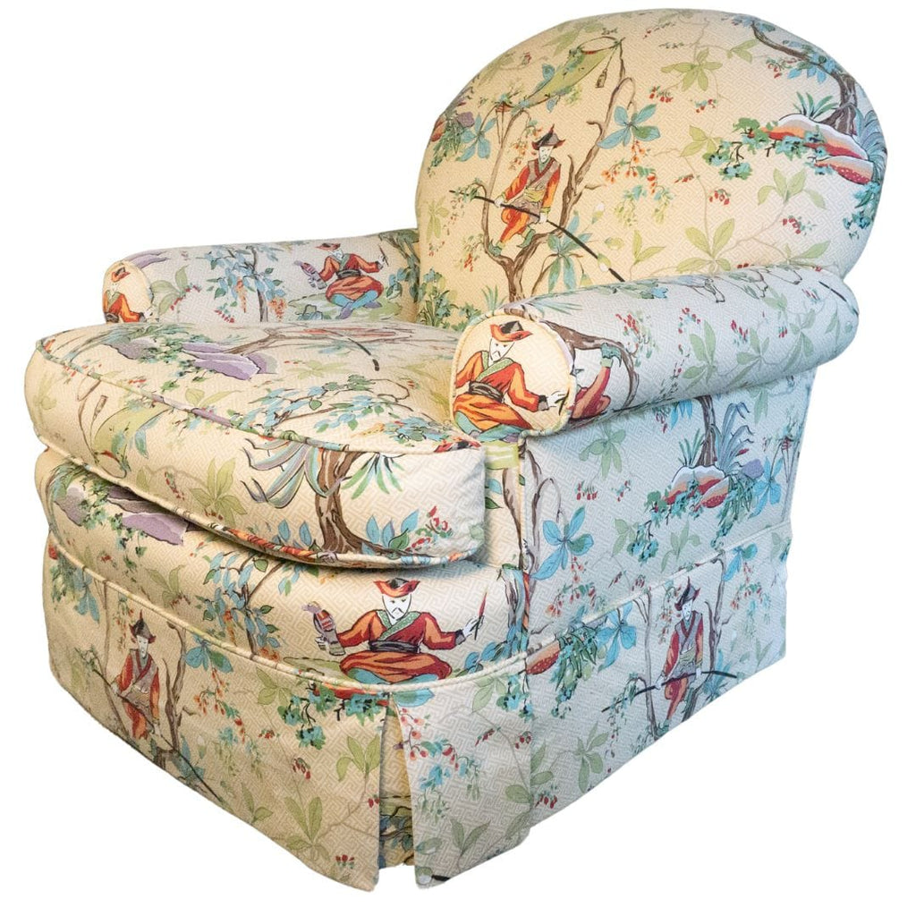 Upholstered armchair with Asian-themed fabric.