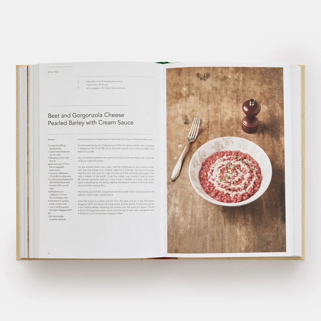 Open cookbook showing a recipe for Beet and Gorgonzola Cheese dish on a wooden table.