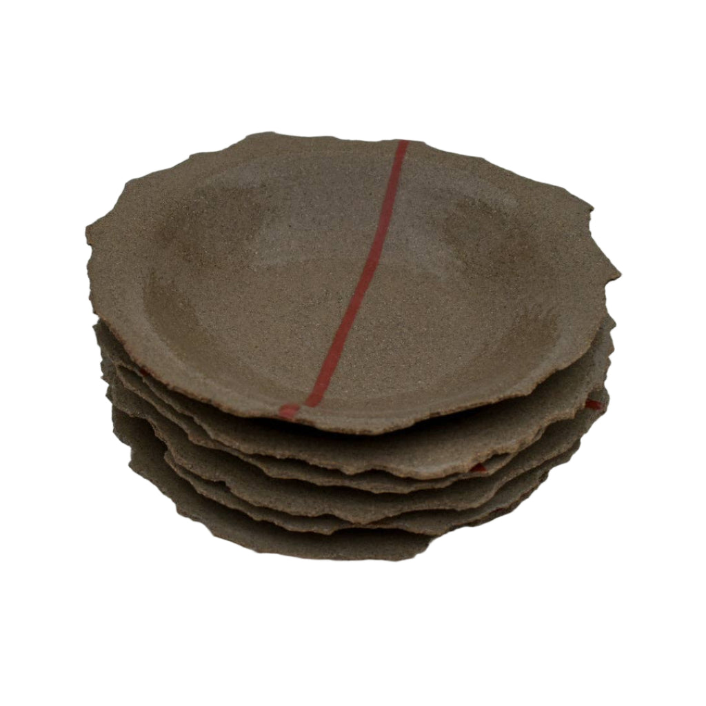 Stack of brown ceramic plates on a white background