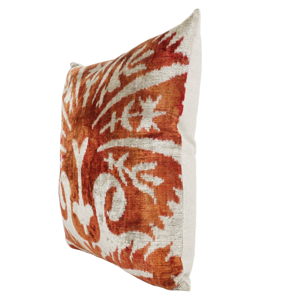 Orange and white patterned decorative pillow.