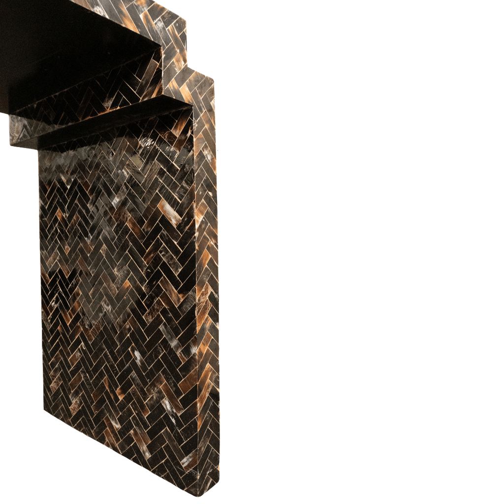 Dark brown herringbone pattern wall and shelf.