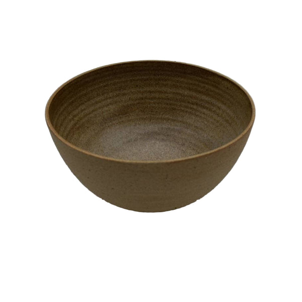 Brown ceramic bowl on a light gray background