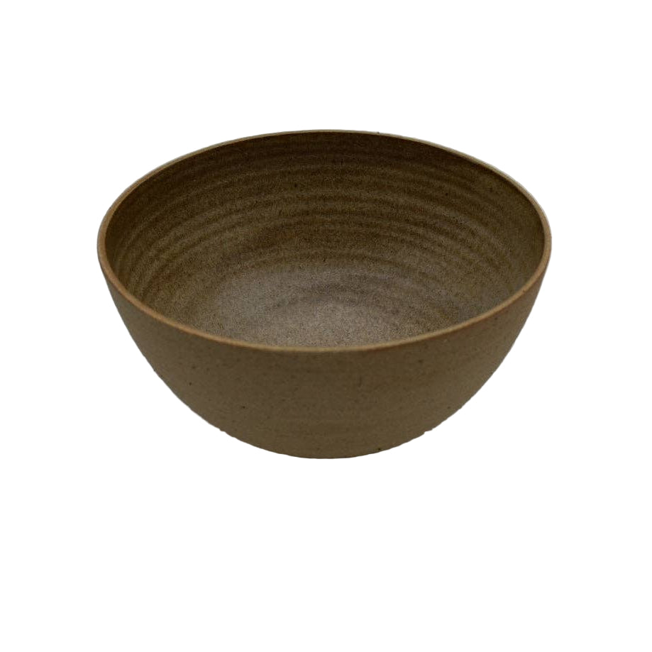Brown ceramic bowl on a light gray background