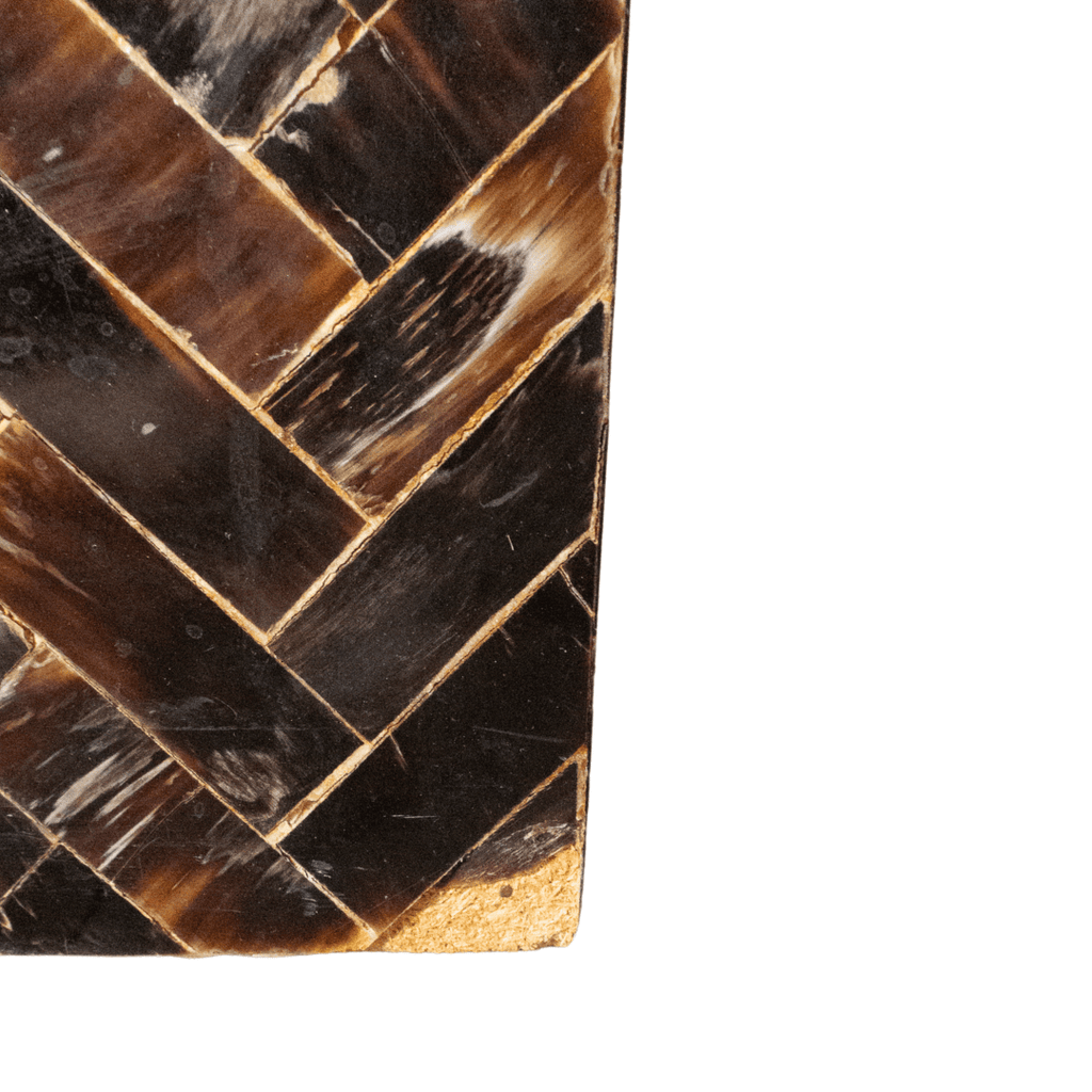 Herringbone pattern of dark brown and tan material.