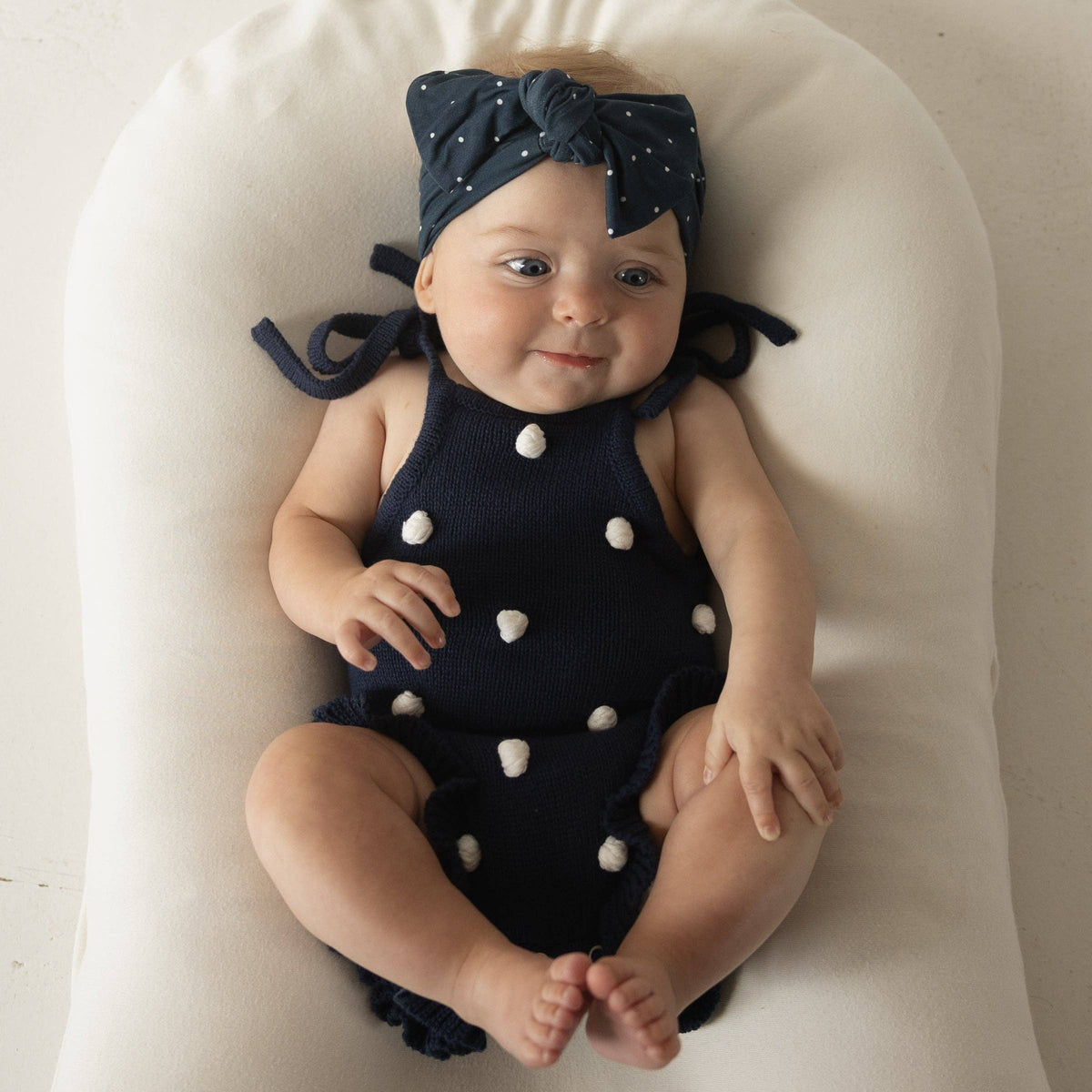Poka Dot Navy Blue Knit Ruffle Romper