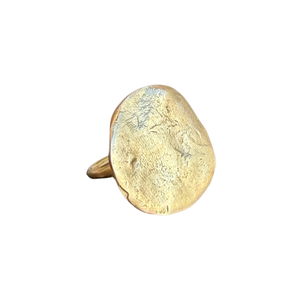 Gold ring with a textured surface on a white background