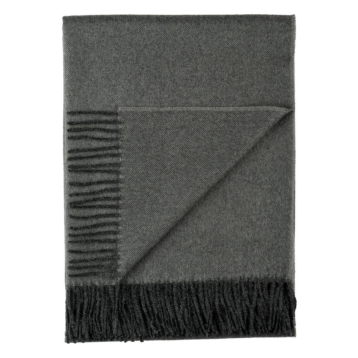 Gray blanket with fringed edges on a white background