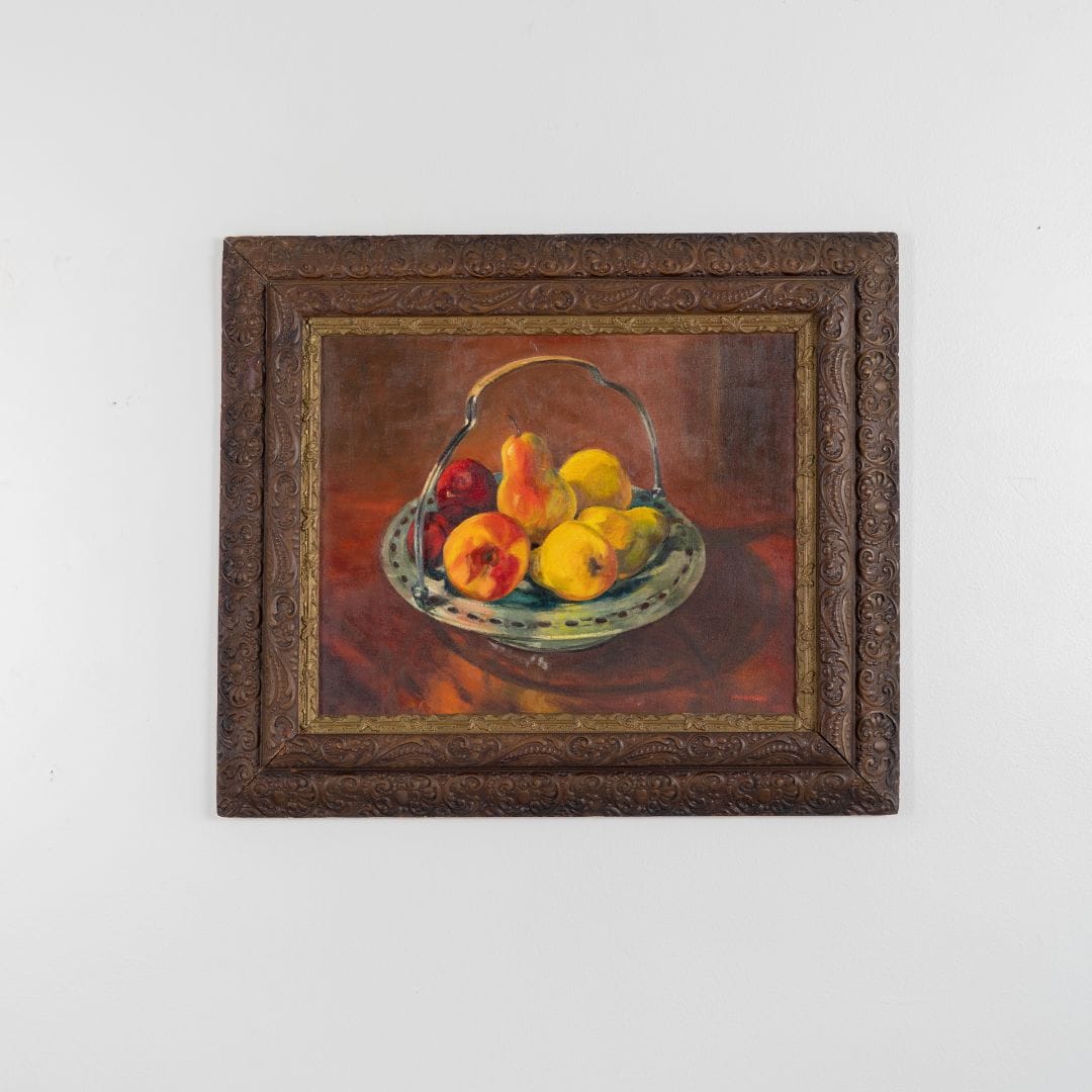 Framed painting of a still life with fruits on a white background