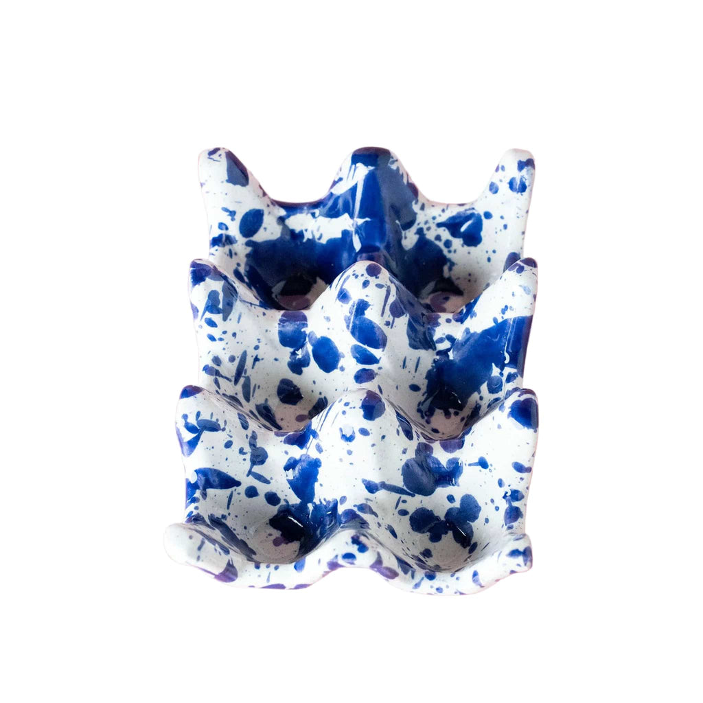 Blue and white ceramic dish on a pink background