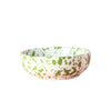 Speckled patterned bowl on a pink background