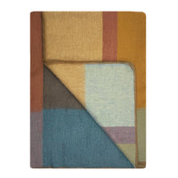 Folded fabric with multicolored pattern on a white background