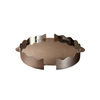 Metallic ashtray on a brown background