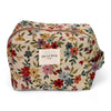 Floral patterned cosmetic bag with 'De Lamar' label on a white background