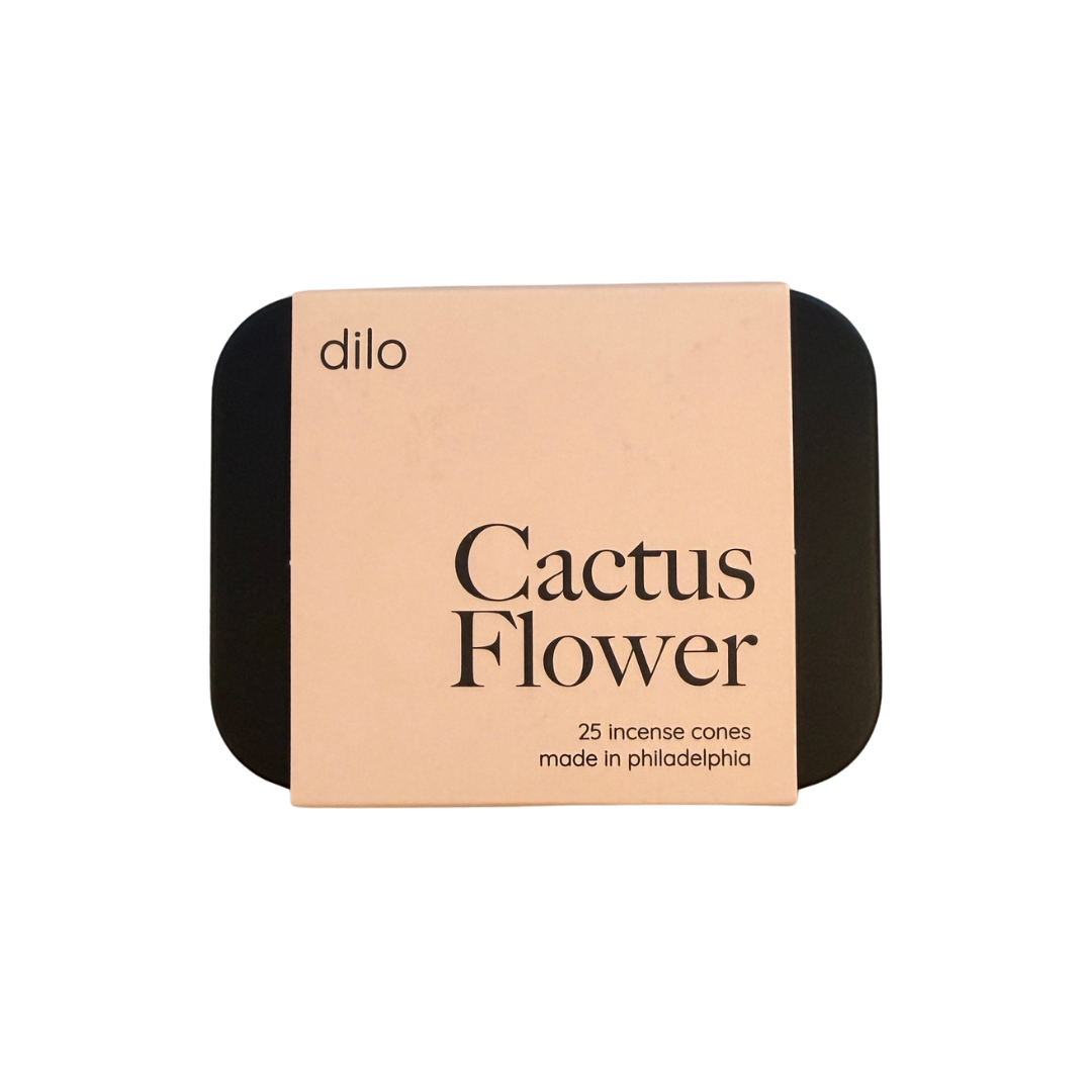 A square product box for Dilo Cactus Flower incense cones, featuring a light peach-beige front label with black text and black rounded corners on a white background.