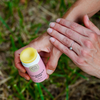 Calendula Rose Salve close up product photo of a model testing the product 