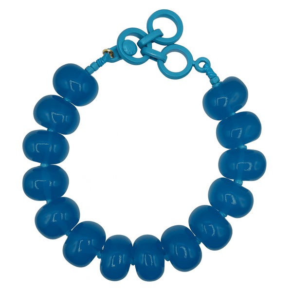 Blue beaded bracelet on a white background