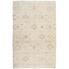 Handwoven wool Kilim rug with white, sage green, light blue, gold, tan, and cream tones. Modern Nomad Home Denver CO