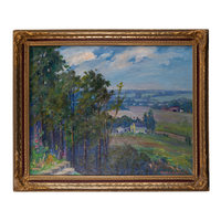 An Impressionist landscape oil painting in a decorative gold frame, depicting a lush green forest, rolling fields, and a small farmhouse under a cloudy blue sky.