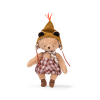 Stuffed teddy bear wearing a hat and plaid outfit on a white background
