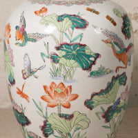 Decorative ceramic vase with colorful floral and bird patterns on a white background