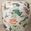 Decorative ceramic vase with colorful floral and bird patterns on a white background