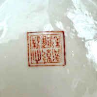 Red seal on a white ceramic surface