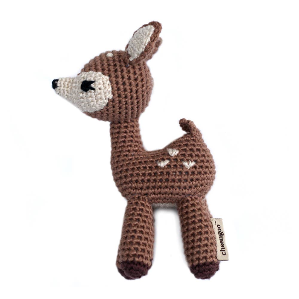 Crocheted deer toy with a visible brand label on a white background