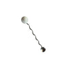 Metallic hairpin with spherical ends on a white background