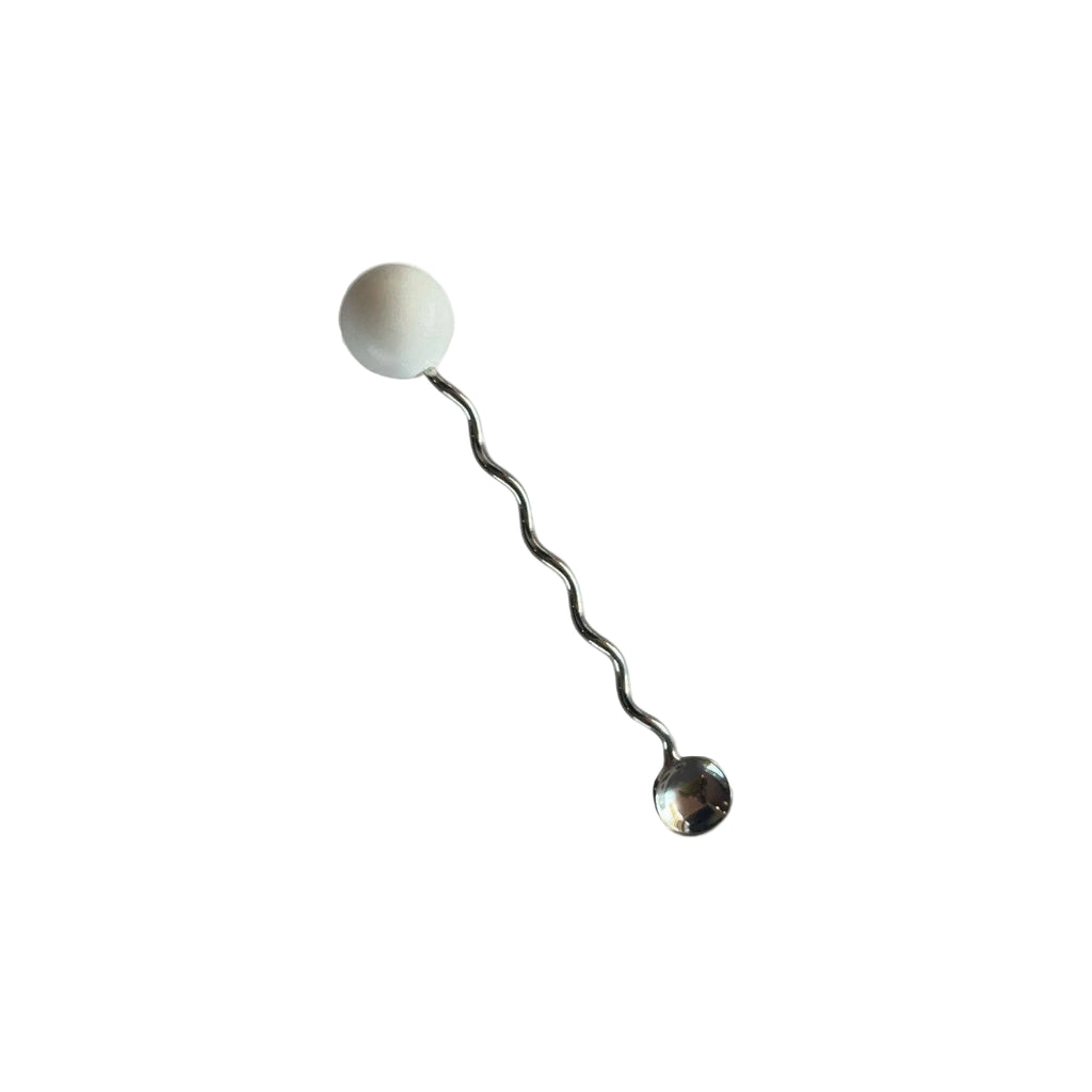 Metallic hairpin with spherical ends on a white background