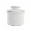 White ceramic butter dish with lid on a white background