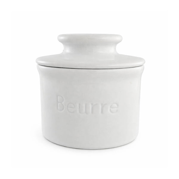 White ceramic butter dish with lid on a white background