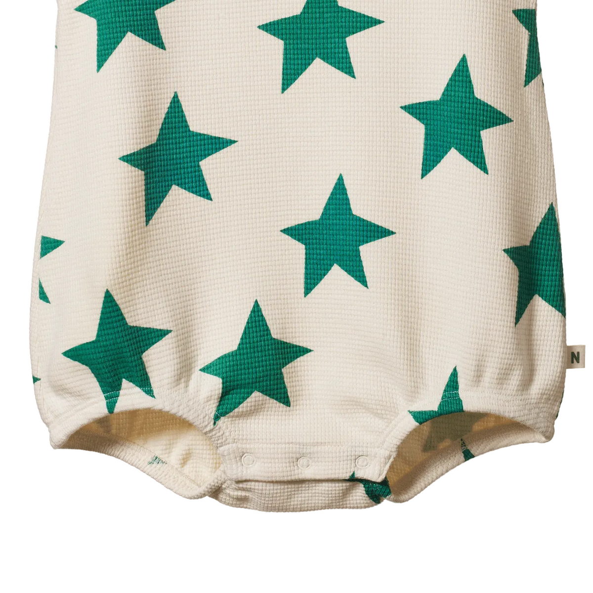 Baby romper with green star pattern on a white background