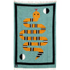 Woven blanket with a snake design on a teal background
