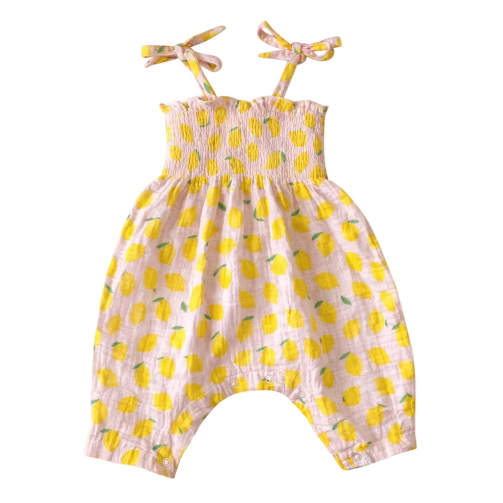 Baby romper with lemon pattern on a white background