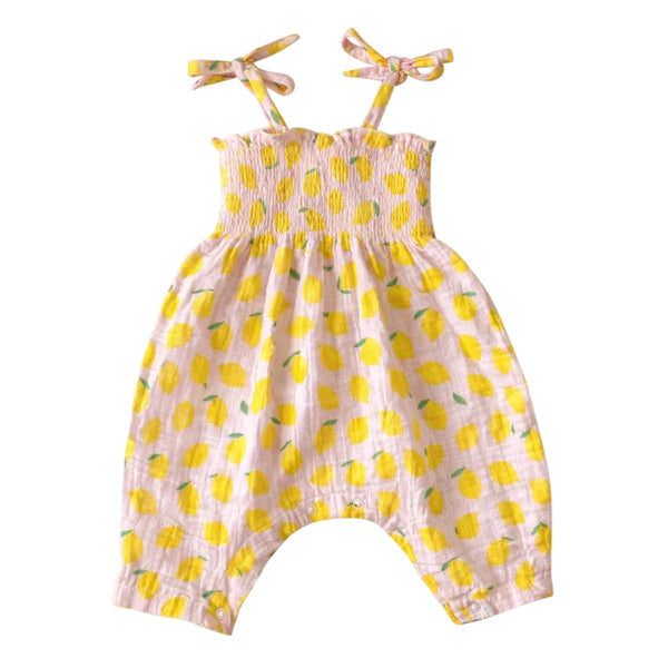 Baby romper with lemon pattern on a white background