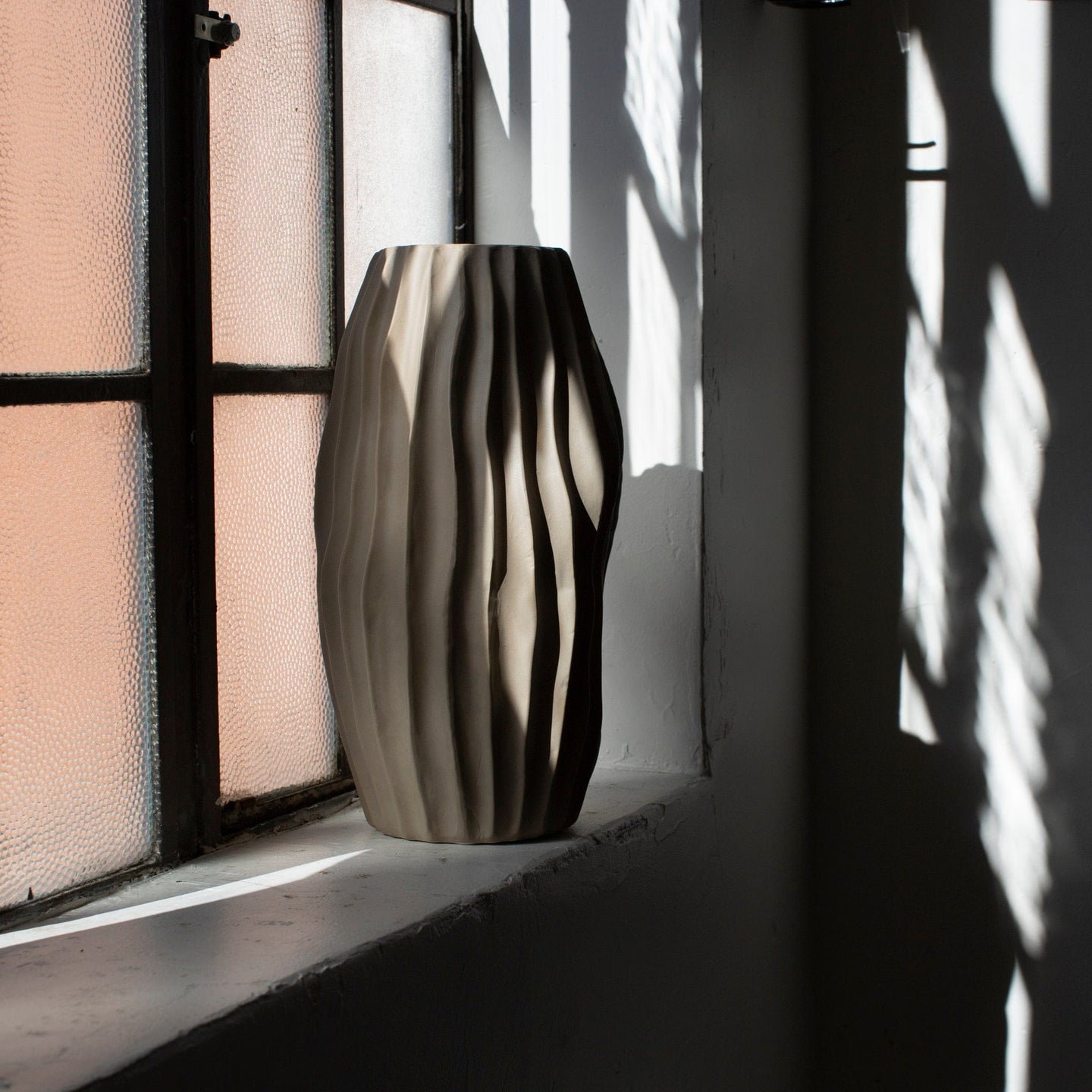 Textured vase by window
