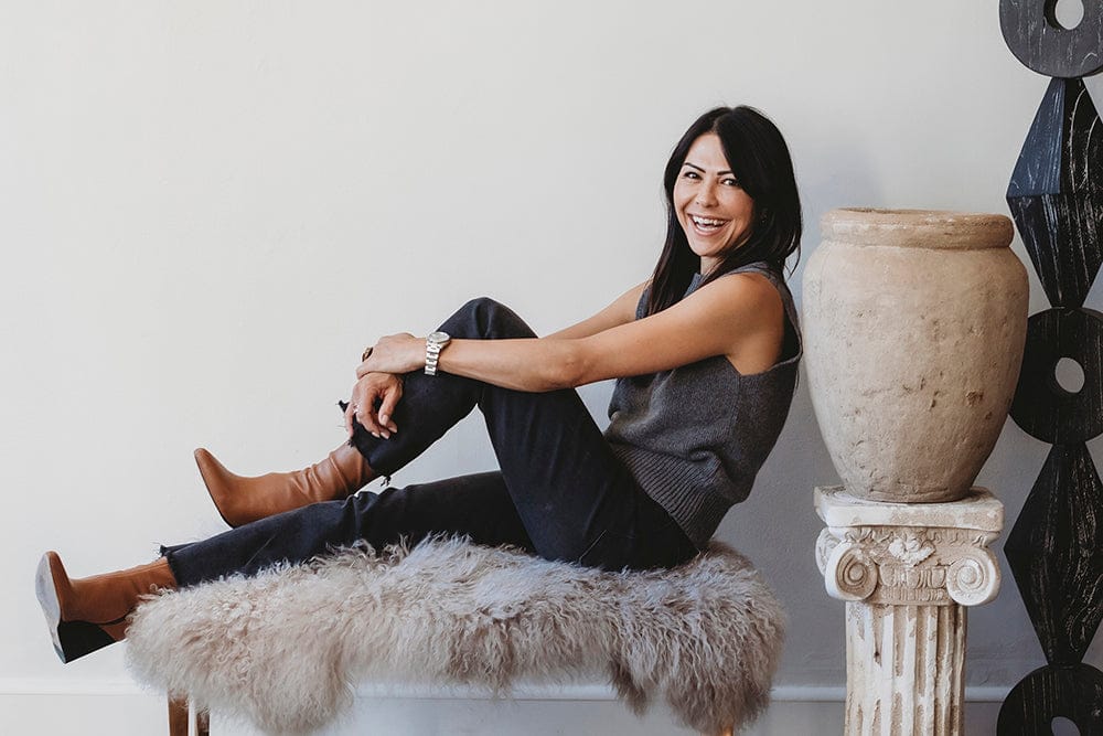 Becky Miller of Modern Nomad, 2026, seated on bench