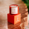 NUEVE LEONES Candle orange candle up close product photo