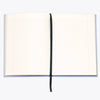 Open notebook with lined pages on a white background