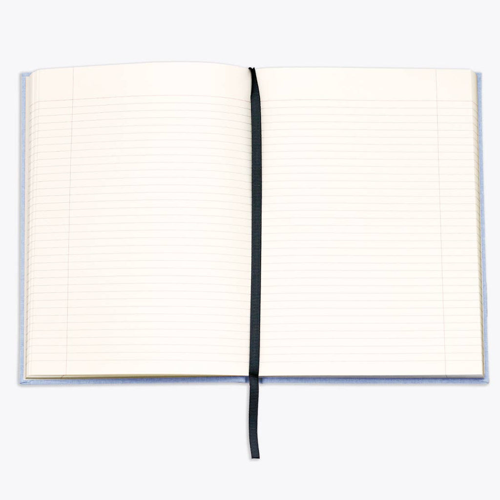 Open notebook with lined pages on a white background