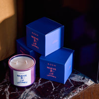 NUEVE LEONES Candle product photo showing 3 boxes and one candle
